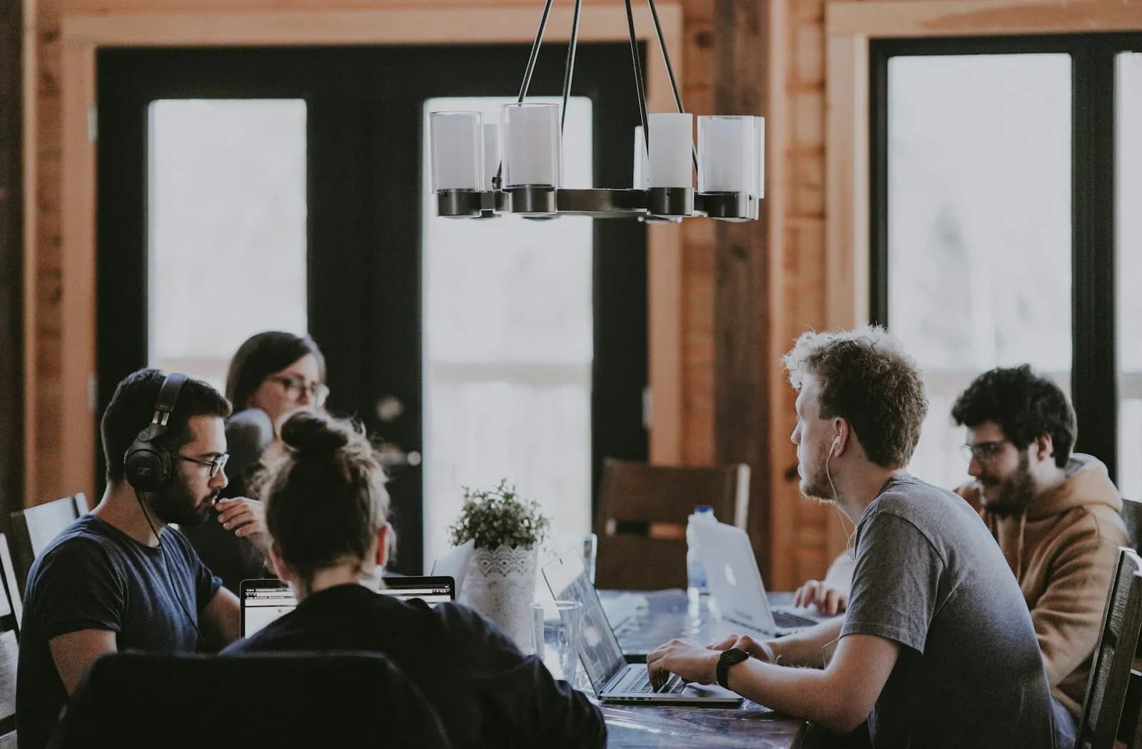 A group of engineers working together around a large table
